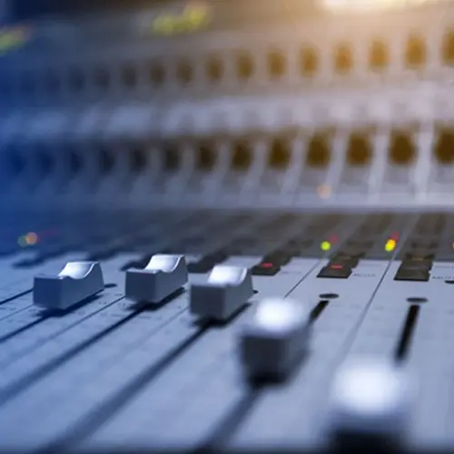 Close up of a mixing board.
