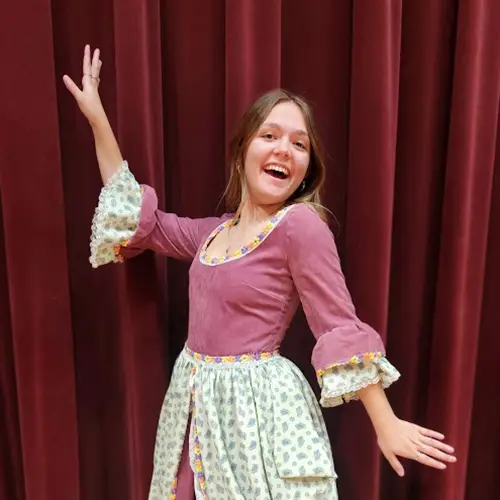 Student posing while practicing for the opera performance.
