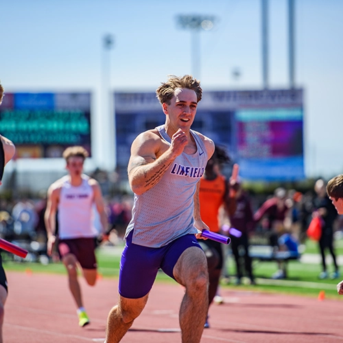 Liam running in the 4x100 meter relay.