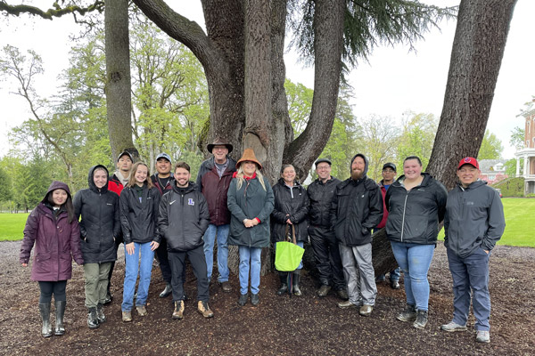 Photo of Brooke with peers and faculty and staff at the 2022 Camas Festival.