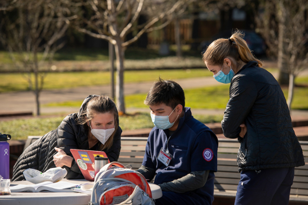 Leo Pham with friends on Portland nursing campus