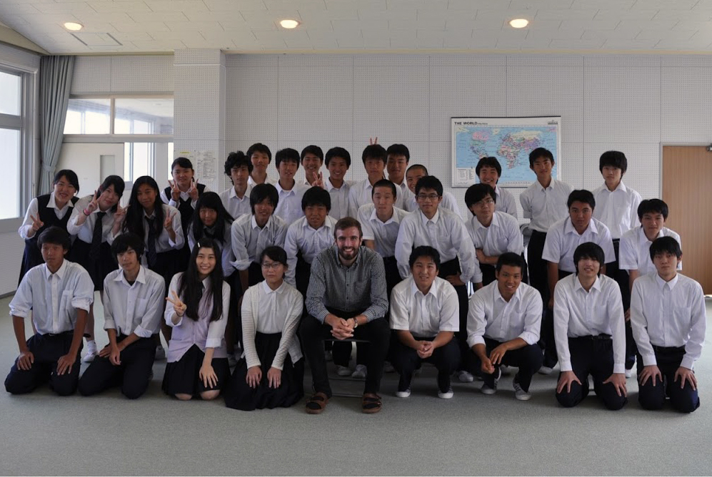 Joel Trousdale with students in Japan