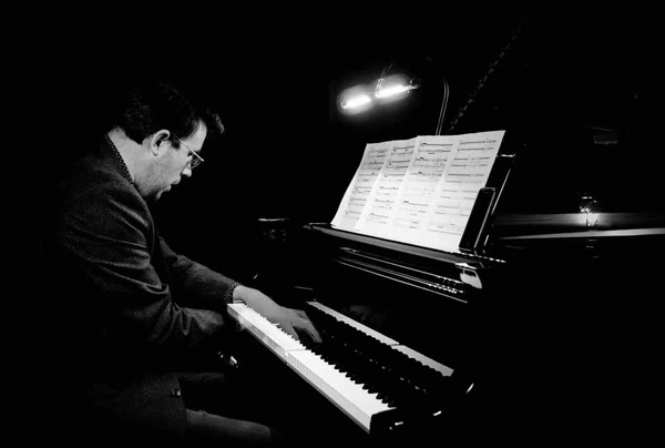 Zach Gulaboff Davis '14 playing the piano.