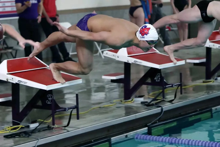 Andrew Lee in swimming pool getting ready to start race