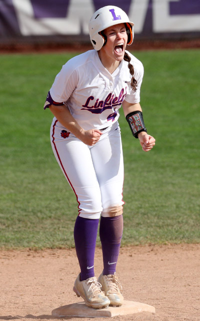 Baily celebrating on base during a softball game