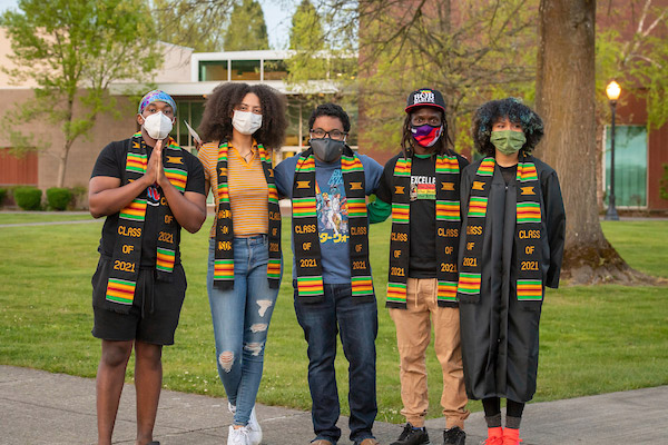 Ray-Ray pictured with four of his fellow graduates at the Black Excellence celebration during the 2021 Commencement weekend