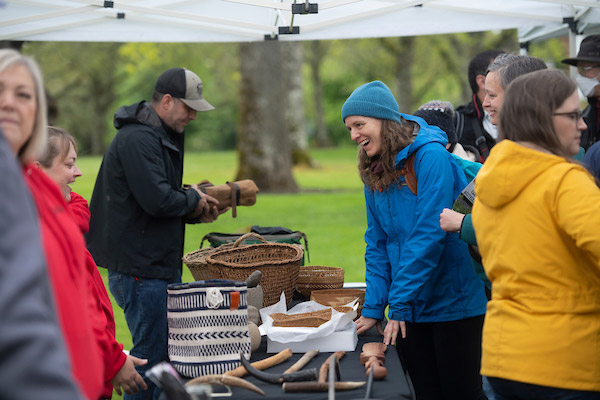 Attendees at the 2022 Camas Festival visiting booths in the Oak Grove.