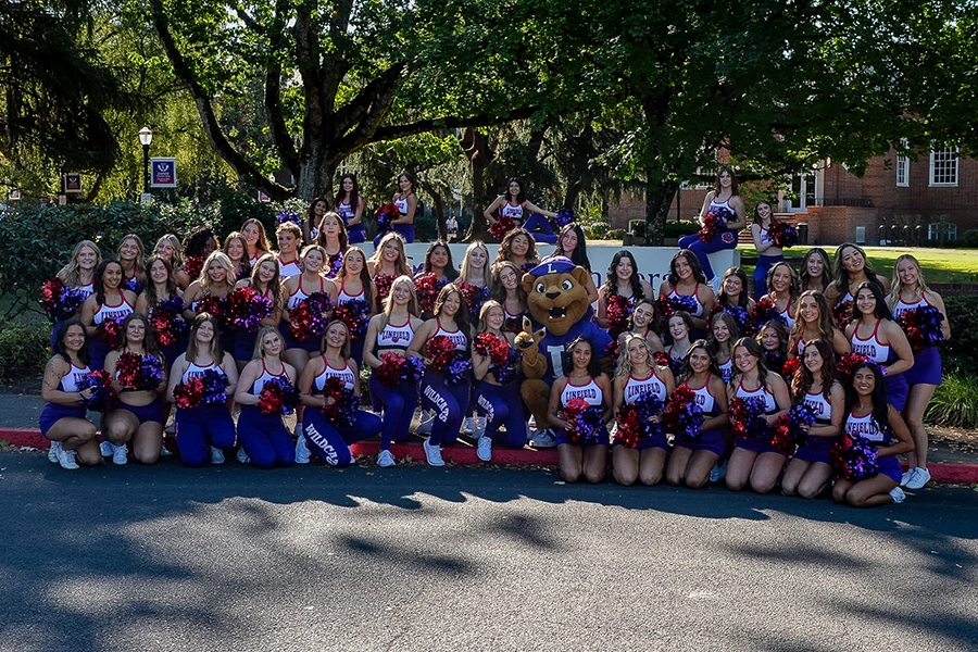 Group photos of the cheer and dance team.