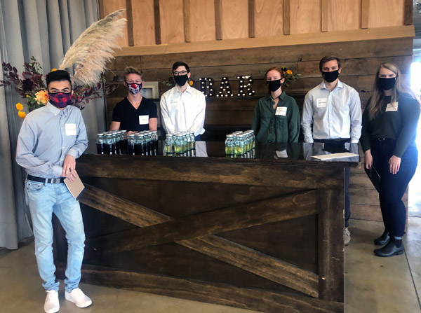 Evan and his classmates at a winery preparing for a wine tasting