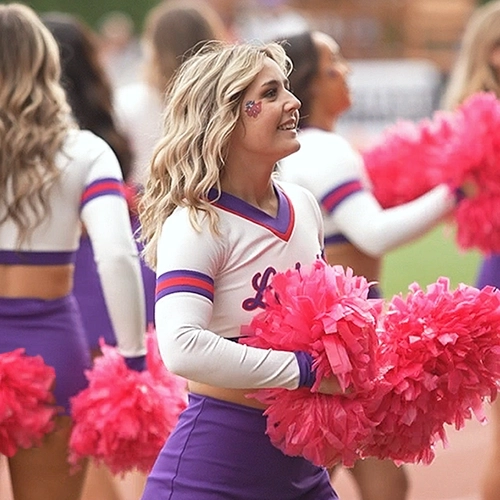 Grace cheering at a football game.