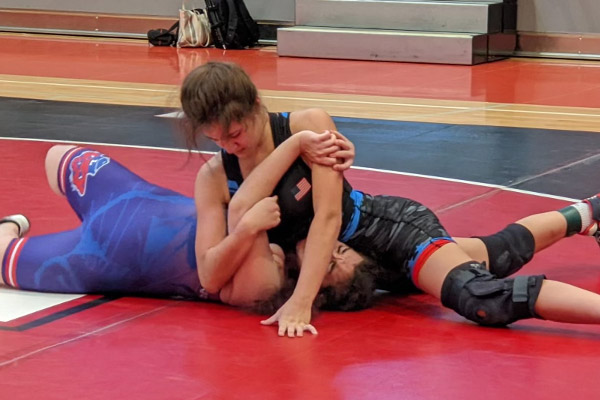 Hannah Gillas in a pin during a match.
