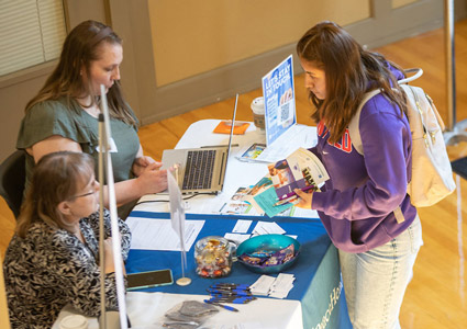 Female student speaking to employer at the Job Fair.