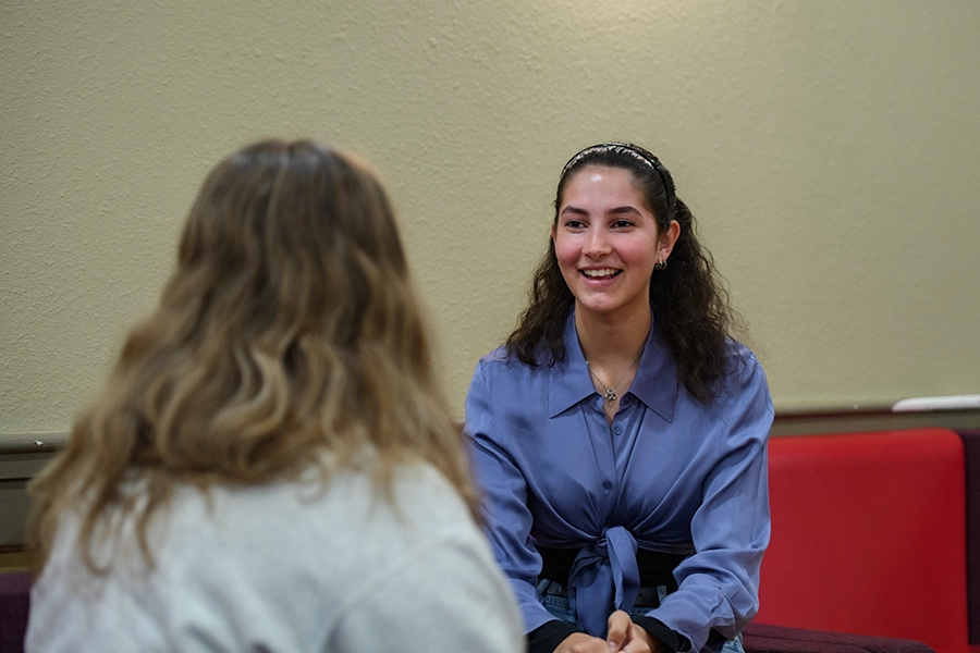 Kalina talking to a friend in Fred Meyer Lounge.