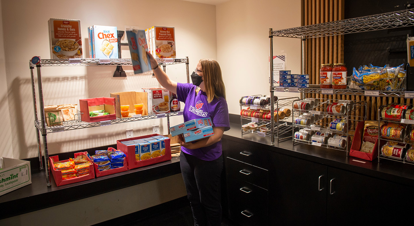 Isabella Dixon '25 stocking the shelves in Linfield's student food pantry