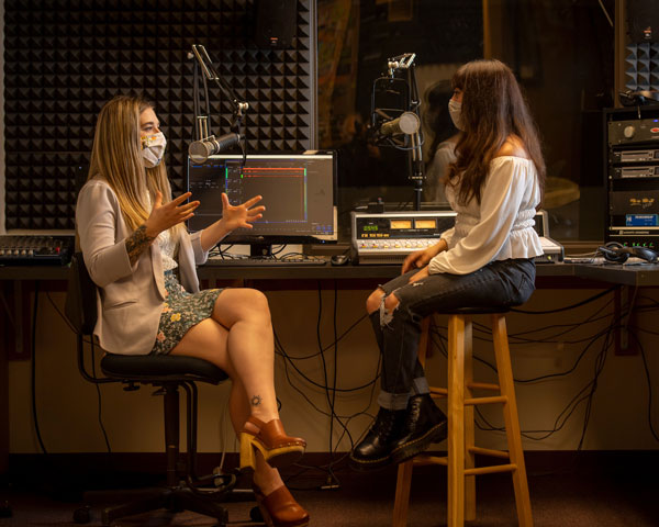Kendall Harrison '21 and Nathaly Sanchez '21 in Linfield's podcast studio