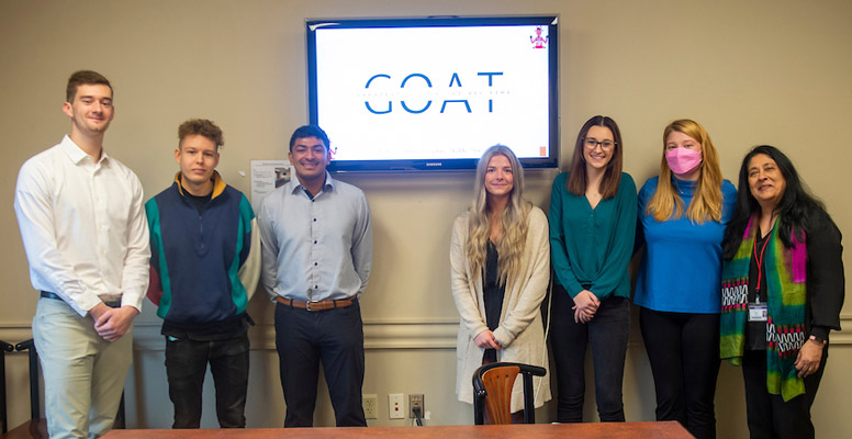 Grant Blodgette '19 with Professor Gayatree Sarma and her promotions management students after their presentation for GOAT NW.