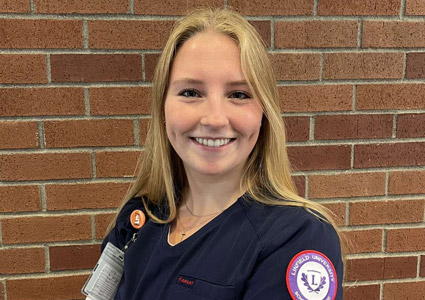 Portrait of Sydney Winters in her nursing scrubs.