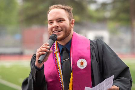 Male student giving speech at the 2021 Commencement