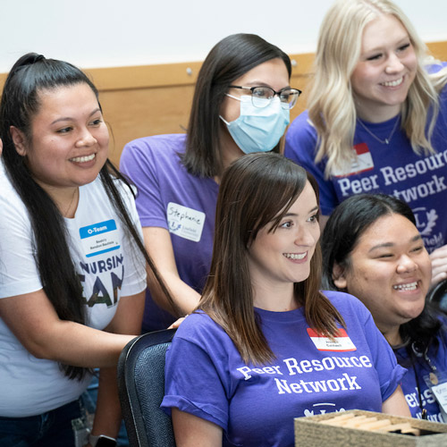 Five nursing students wearing "Peer Resource Network" t-shirts.