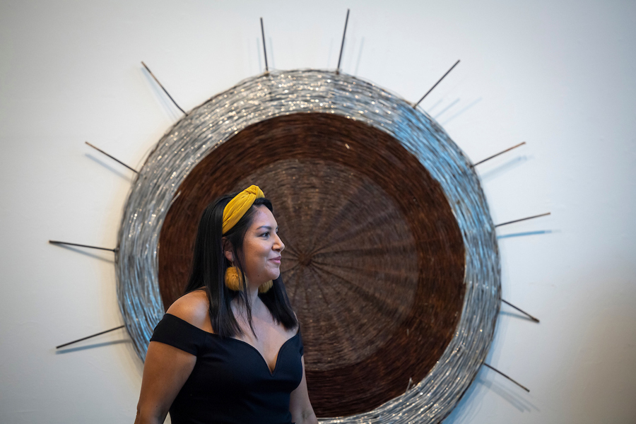 Rhiannon ‘Skye’ Tafoya speaking at her art exhibit opening.