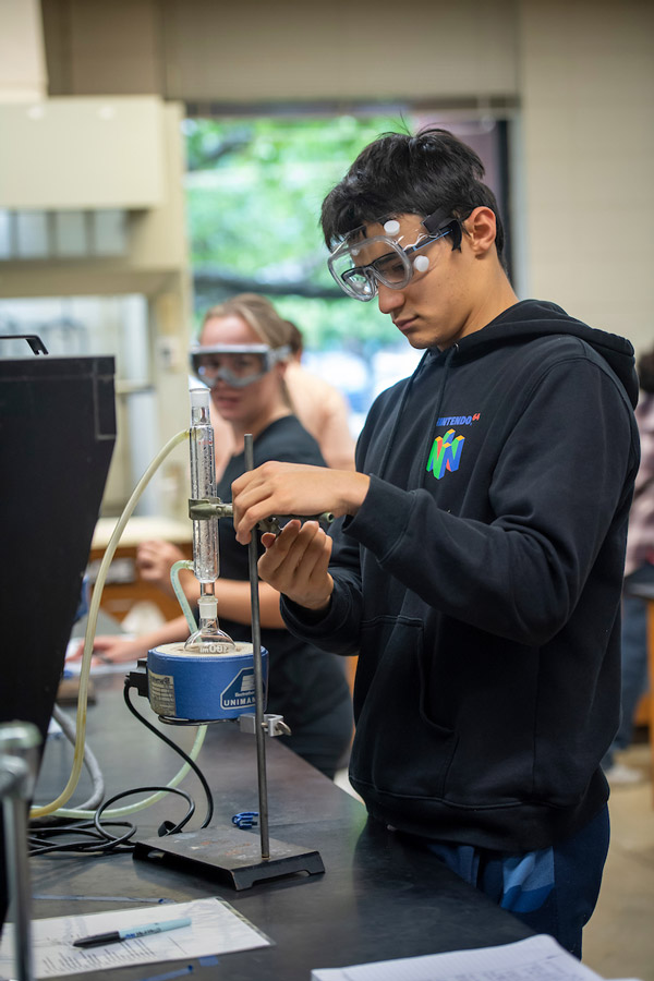 Two students working in a science lab.