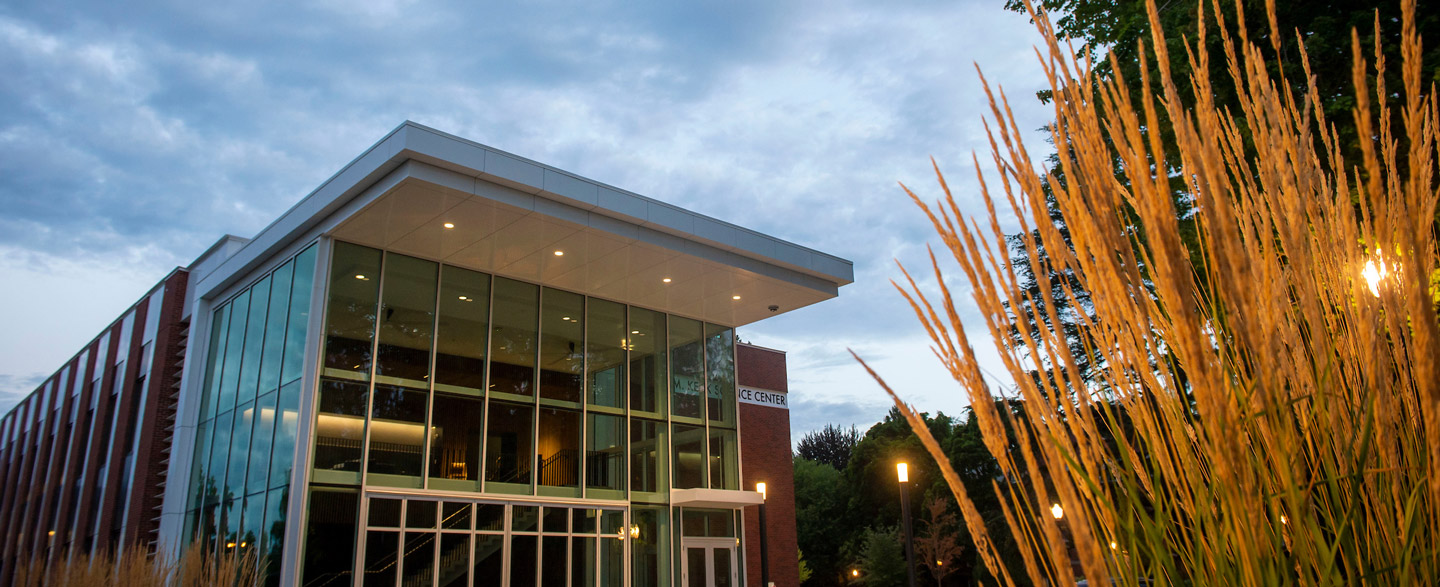 The front of W.M. Keck Science Center at dusk.