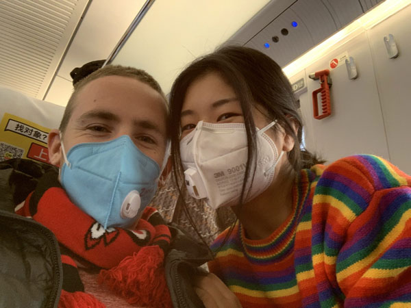students with masks on airplane