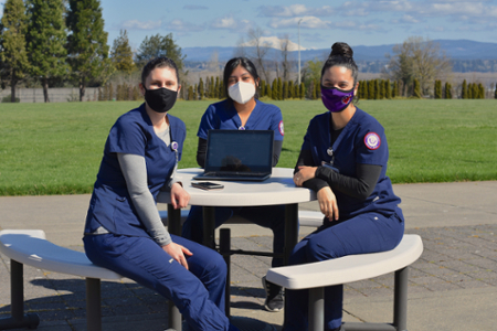 nursing students study outside in masks