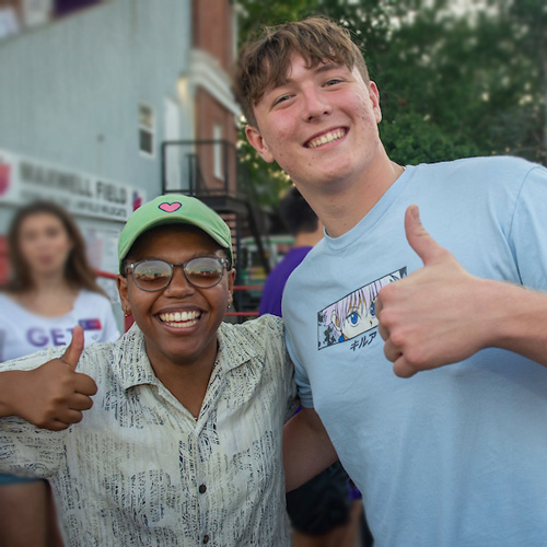 Two Linfield students giving thumbs up.