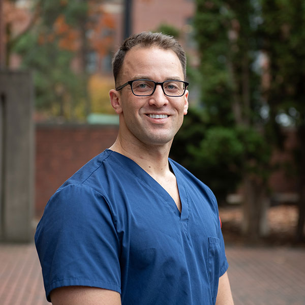 male nursing student in scrubs