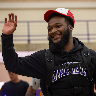 male student at Convocation ceremony receiving his acorn