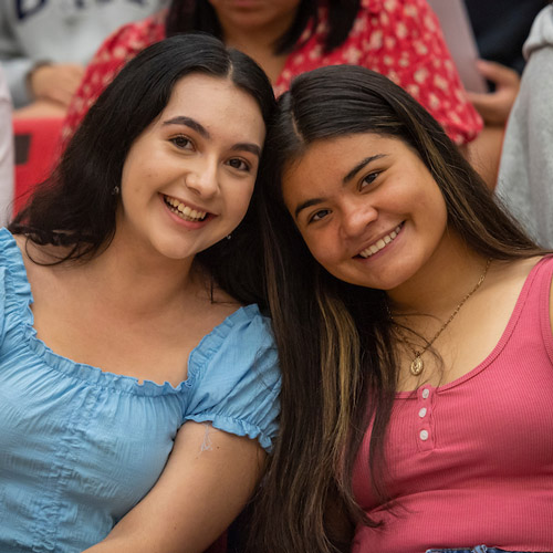 two female students at Convocation ceremony