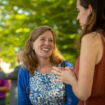 Linfield staff member talking to a student