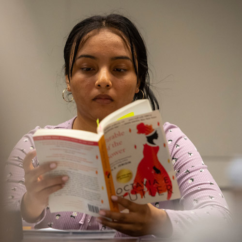 female student reading a book