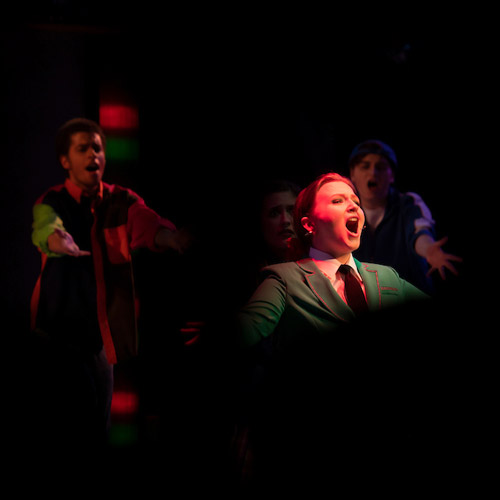 Female student performing solo in Heathers the Musical.