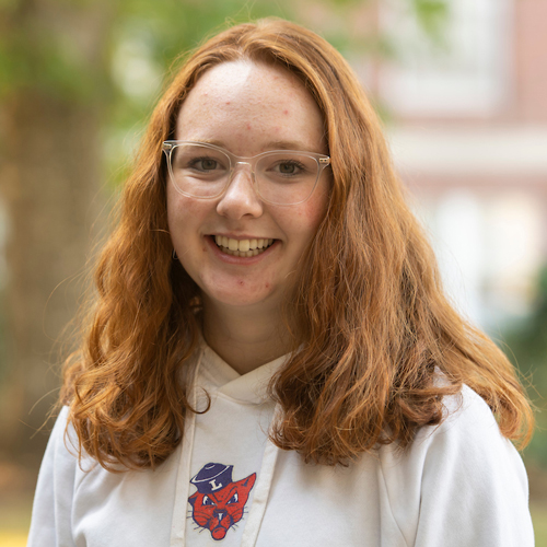 Portrait of female student wearing Linfield sweatshirt.