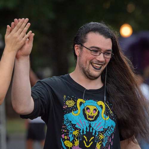 male student cheering at Cat Camp 2022