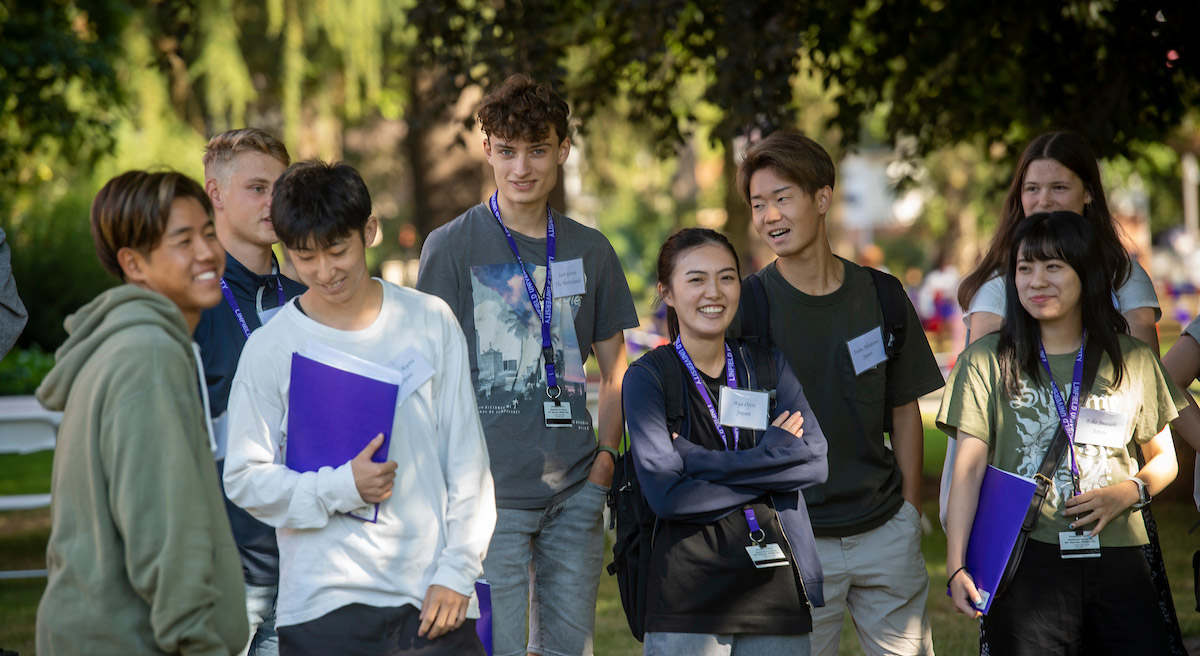 international students gathering at orientation in the academic quad.