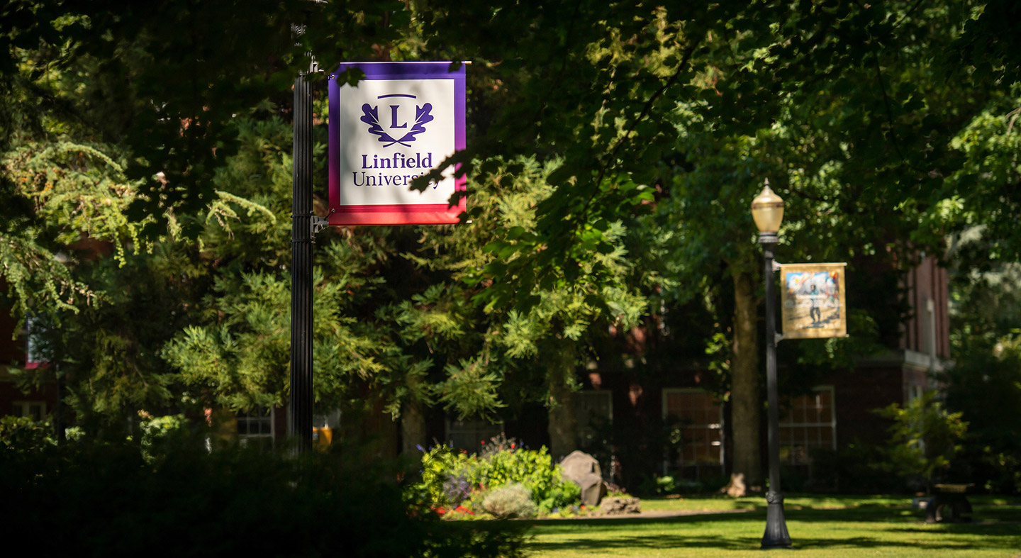 Linfield University banners in the academic quad