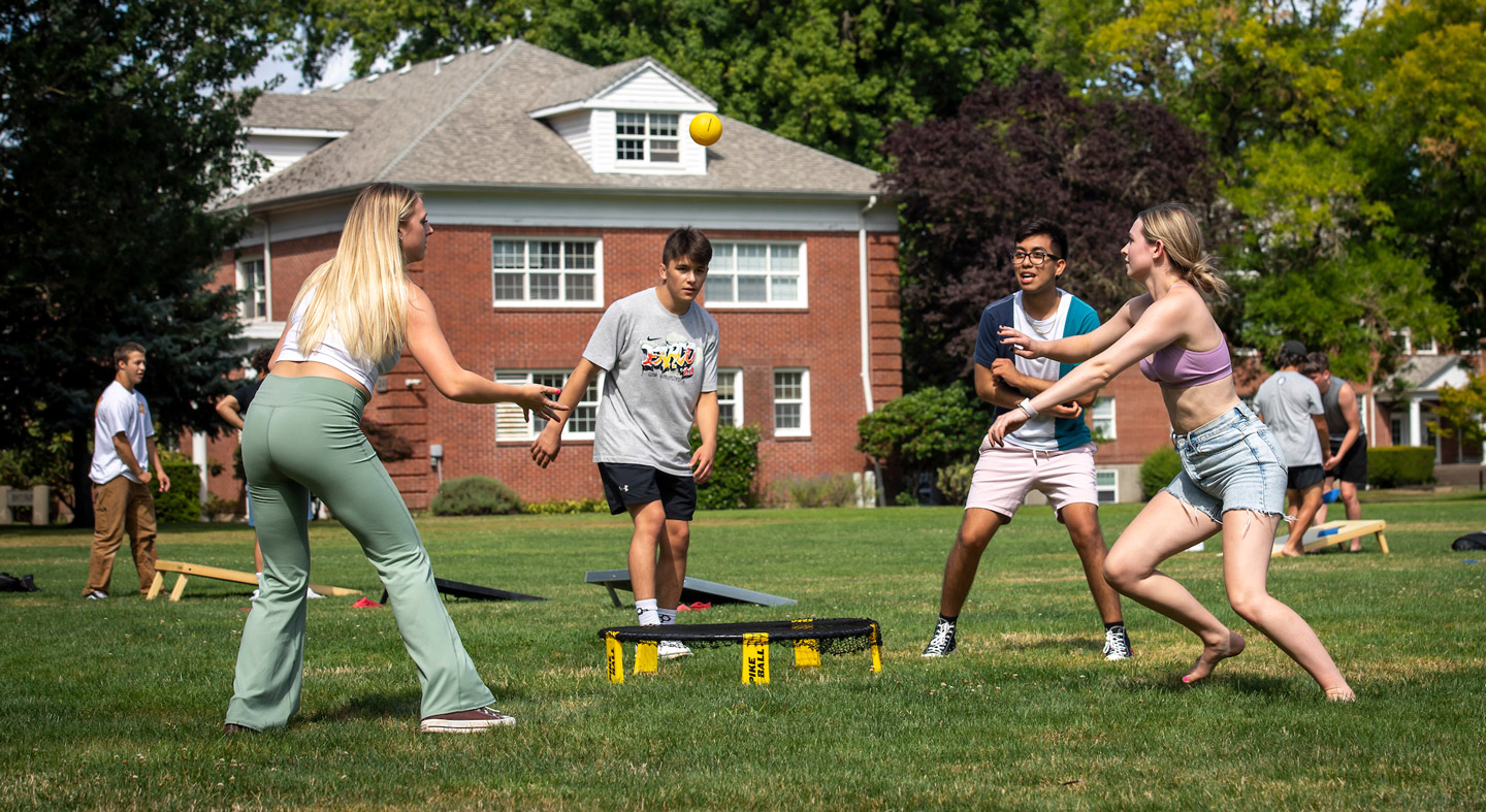 Students playing lawn games during orientation week.