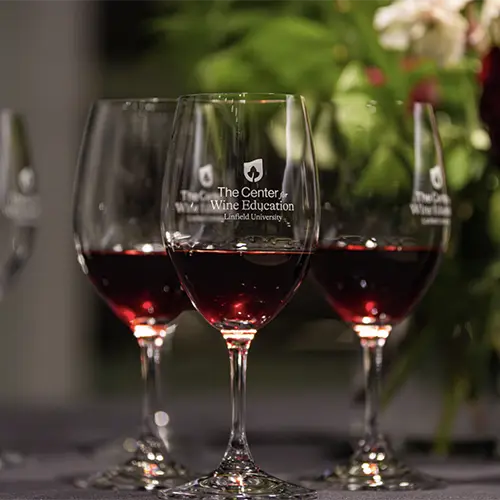 wine glasses showing the Center for Wine Education logo.