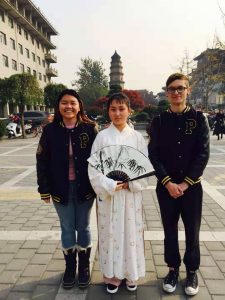 My friend Alice and I posing with a woman wearing traditional Tang Dynasty clothing, Xi'an