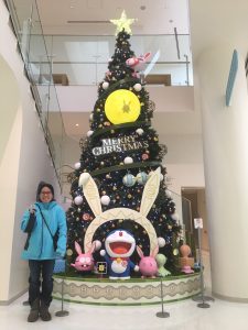 Me in front of Christmas tree in Doraemon Museum