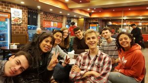 Group of international students in a restaurant