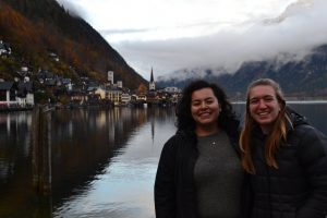 2 female students in front of lake Hallstatt.