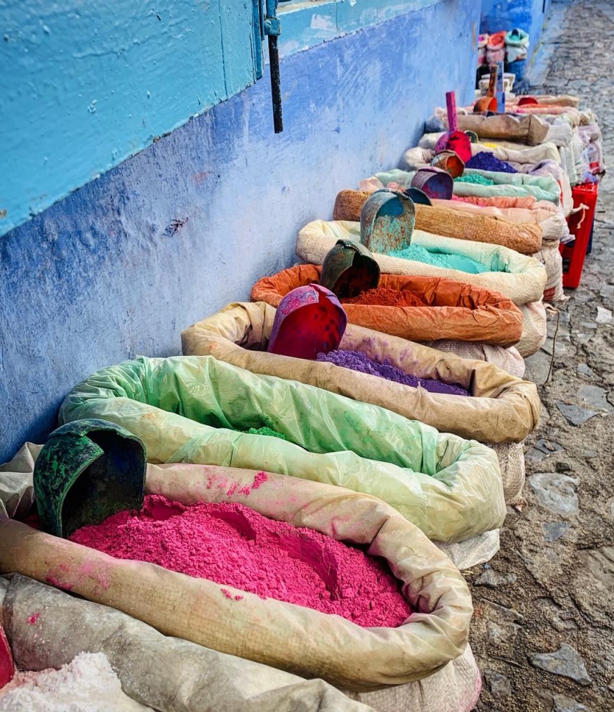 Chefchauen, Morocco street market selling different colored beans and rice.