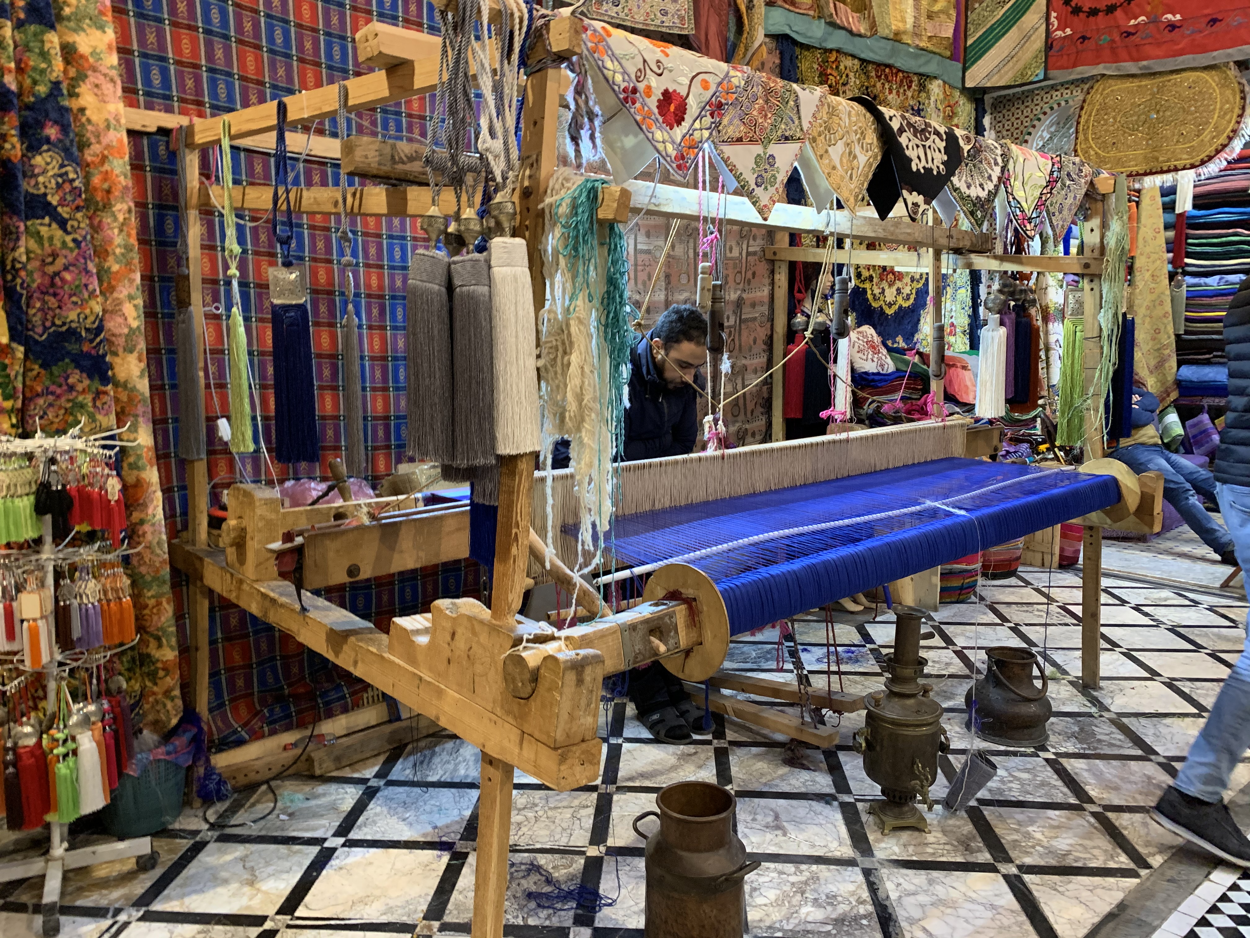 A large loom with right blue yarn.