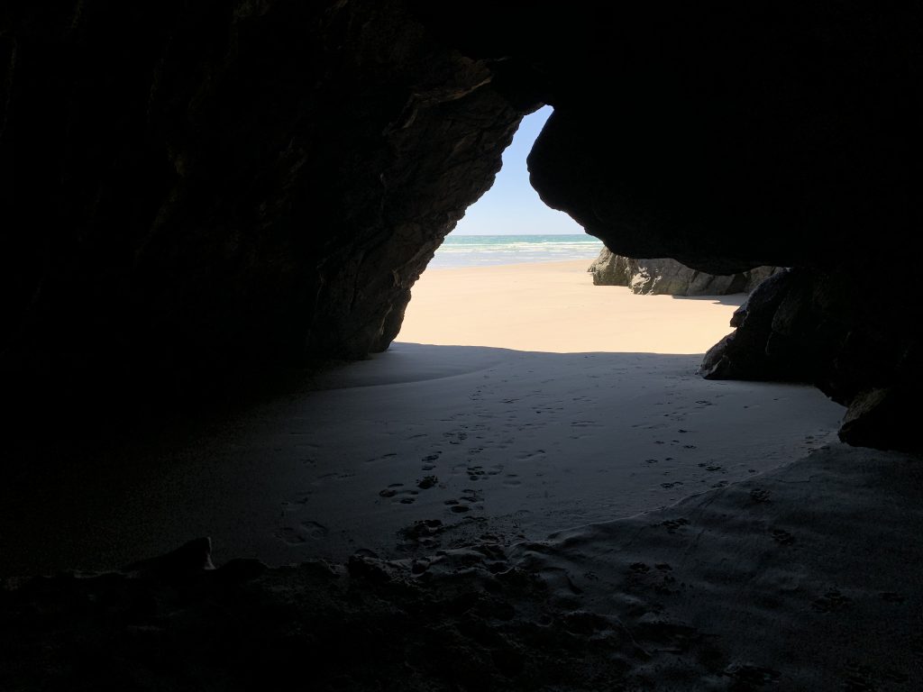 Looking through caves out to the beach and ocean at Doctors Point