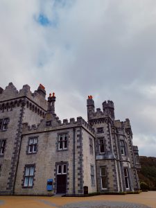 A large castle next to Kylemore Abbey