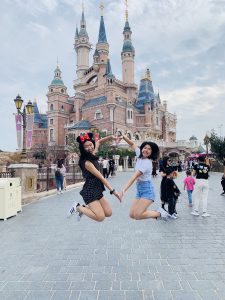 Sarah and I jumping in front of Shanghai Disneyland